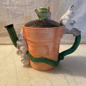 Ceramic Tea Pot Shaped Like A Flower Pot With Rabbits
